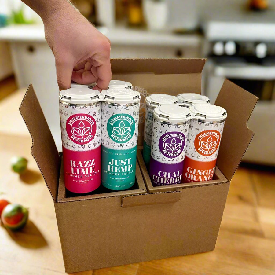 Hand pulling cans of Shimmer Seltzer